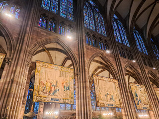 Interior of Cathedral of Our Lady of Strasbourg with tapestries in Strasbourg, France