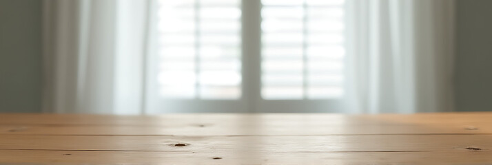 Poster - A wooden tabletop features a blurred window with shutters partially hidden behind a flowing white curtain in the background._00001_