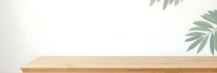 Poster - A wooden table top is placed against a white wall with a subtle leaf pattern in the background._00002_