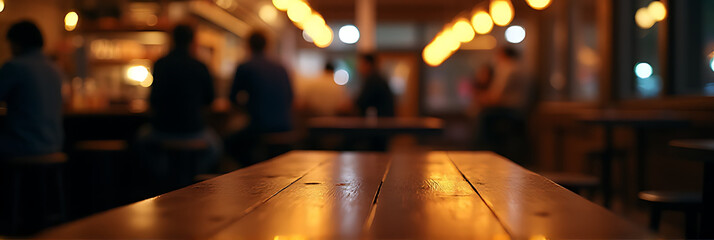 Poster - A blurred wood table is partially visible in the dimly lit background of a bustling nighttime café or restaurant scene._00022_