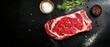 © Fernando - Raw Ribeye Steak on Dark Background with Spices and Herbs
