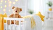 © Vilaysack - A cozy nursery featuring a soft teddy bear on a white crib with yellow accents, creating a warm and inviting atmosphere for a baby.