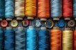 © Shajnur - A row of colorful threads with buttons on top