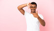 © luismolinero - African American man on copyspace pink background focusing face. Framing symbol