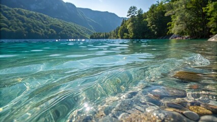 Poster - A body of water with a rocky shoreline and mountains in the background