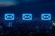 © Home Studio - Three glowing email icons over a cityscape at night.