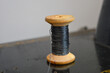 © Виталина Митрофанова - wooden spool with black thread wound around it sewing materials DIY handmade crafts nostalgic aesthetics upcycling modern sewing techniques tutorials simple objects inspiration eco-friendly reuse