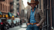 © Ranju - A handsome cowboy, wearing jeans, a blazer and a brown hat, poses on the streets of New York. Full-body shot, photo taken