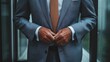 © svastix - A middle-aged man stands in a reflective office space, adjusting his suit jacket cufflinks, projecting confidence, readiness, and anticipation of meeting.