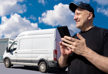 Poster - Man driver of logistics van. Car for delivering goods. Courier with phone near warehouse building. Van driver calls supplier. Man contractor for logistics company. Delivery van behind courier