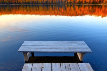 Aufkleber - A serene moment of meditation on a lakeside pier at sunrise, with gentle ripples in the water and soft golden light