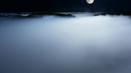 Poster - Moonlight illuminates a misty landscape over tranquil waters at night