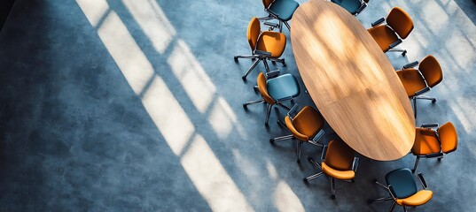 Poster -  A high-angle view of a business conference room with a large table and chairs arranged in a circular pattern, set in a modern office space, representing collaboration and teamwork