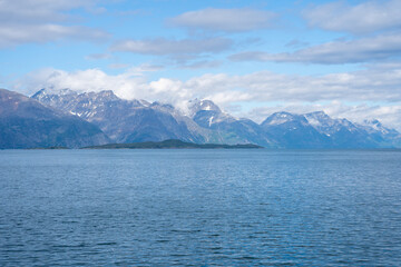  Snowy mountains, fjord and blue sky in Norwegian landscape in Olderdalen, Norway