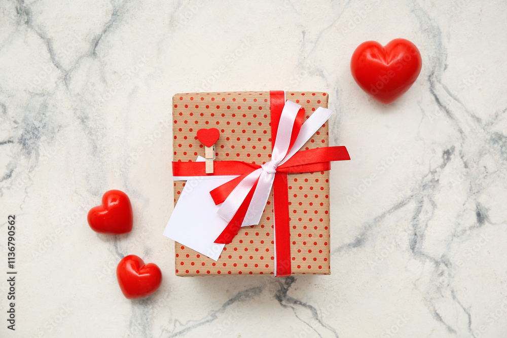 Gift box and hearts on white background. Valentine's Day celebration
