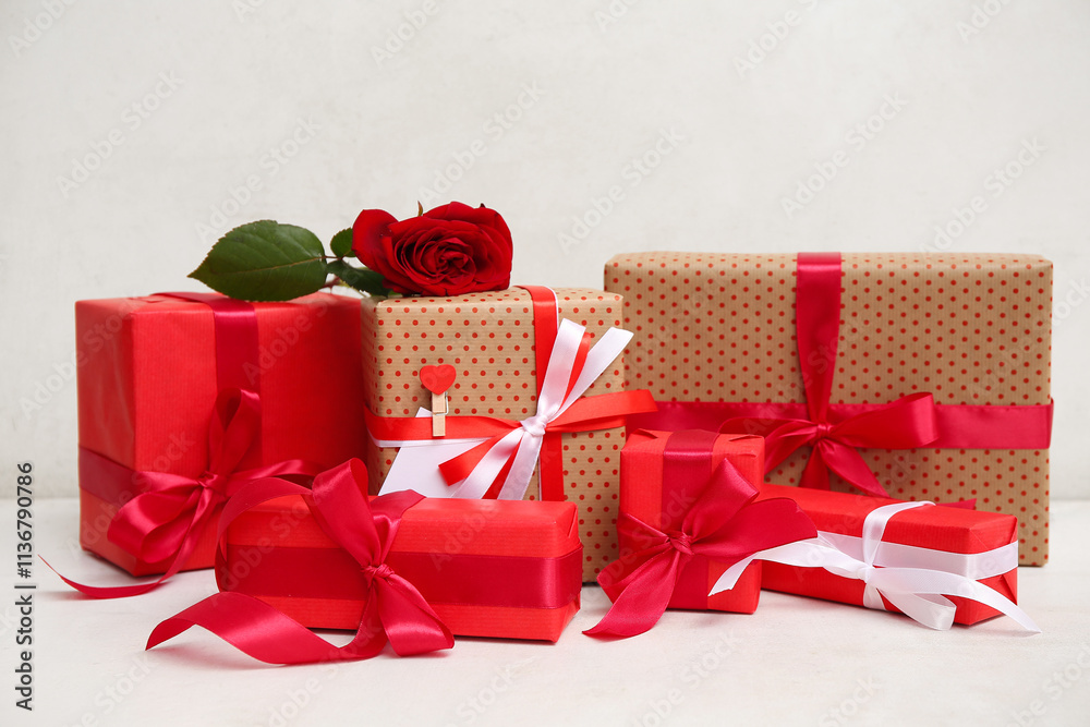 Gift boxes and beautiful red rose on white background. Valentine's Day celebration