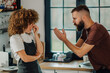 © Zamrznuti tonovi - Young couple arguing in kitchen, woman feeling frustrated and annoyed