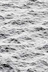 Poster - Calm grey ocean waves create a mesmerizing texture in shades of black and white.