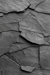 Poster - Textured black slate stone surface with varying layers and cracks for a natural, rugged appearance.