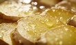 © Handz - Golden Ginger Slices Glistening With Water Droplets