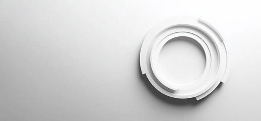 Abstract white circular design element on a light gray background.