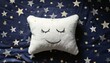 © PandaUniverse - cheerful star-shaped pillow with a sleepy expression,