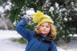 © Volodymyr - Kid with snowball in snow. Winter holiday kids, snowball snowball activity. Child enjoy Christmas vacation. Kid in winter clothes in snowy forest. Trees covered white snow. Kid have fun playing snow