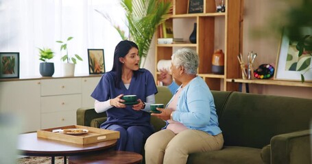 Wall Mural - House, sold woman and caregiver with coffee, conversation and retirement with breakfast in lounge. Funny, nurse and elderly patient on sofa, herbal tea and laughing with kindness, service and support