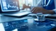 © Maria - A stethoscope placed on medical books while a healthcare professional works in the background, representing medical education and research.