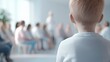 © ATTAKIT - Child observing an inspiring speech at a community event indoor space photo bright environment close-up view engagement