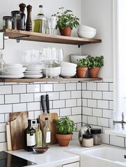 Wall Mural - A small kitchen with clean white tiles, minimal open shelving, and a single potted herb plant as decor.