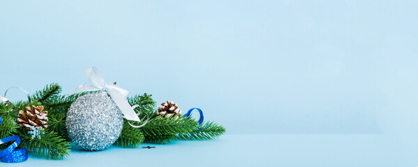 Wall Mural - New Year Christmas tree toy, branches of a christmas tree, New Year decorations on a colored background