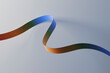 © Westend61 - Multi colored ribbon against gray background