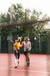 © Westend61 - Young couple having fun on the basketball ground