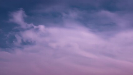 Fototapete - Stunning dusk clouds create a vibrant purple sky over a serene horizon in early evening