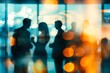 © GlopHetr - Blurred shot of business people at a party in the office.