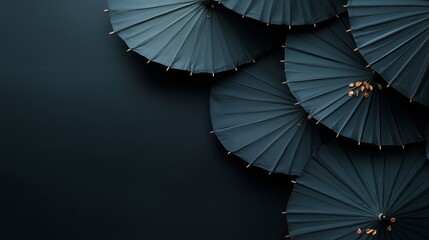 Poster - Various black umbrellas arranged aesthetically on a dark surface with a minimalist style