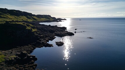 Wall Mural - beautiful coastal landscape at sunrise with sparkling water near rocky cliffs