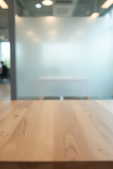Aufkleber - A wooden tabletop sits atop a blurred white glass wall in an office setting, forming a versatile backdrop for product displays._00003_