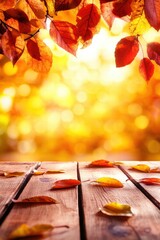 Wall Mural - Autumn leaves scattered on a wooden surface with a warm, blurred background of fall colors and natural beauty.