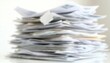 © tonstock - A blurred stack of paperwork representing organization and clutter, highlighting the challenges of document management.