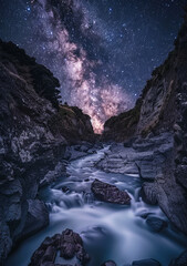 Wall Mural - Stunning night sky with the Milky Way stretching across a starry backdrop. Ideal for nature and astronomy themes.