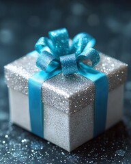 Wall Mural - A beautifully wrapped gift box with glitter and a blue ribbon, perfect for celebrations.