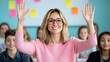 © Elena - Teacher Engages Students in Classroom Activity, Raising Hands for Participation, With a Positive Atmosphere and Active Learning Environment