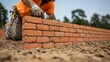 © ขวัญฤทัย เฉลาชาญชัยย - Skilled Mason Laying Brickwork with Precision on a Construction Site, Showcasing a Dedicated Craftsmanship and Professional Technique in Building Projects