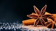 © Raul - Close-up of star anise and cinnamon sticks with sugar, showcasing rich textures and warm colors against a dark background.