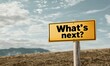 © FocusFusion - Conceptual traffic sign asking what to expect next in an open landscape with mountains and cloudy sky