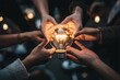 © StockUp - A group of hands holding a glowing light bulb symbolizes collective creativity and shared ideas among people.