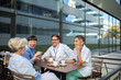 © Marko Geber - Happy medical professionals talking on a break