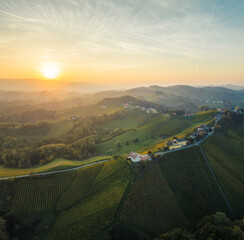 Wall Mural - aerial sunset landscape of the picturesque, autumn-covered rolling hills near maribor, close to the 